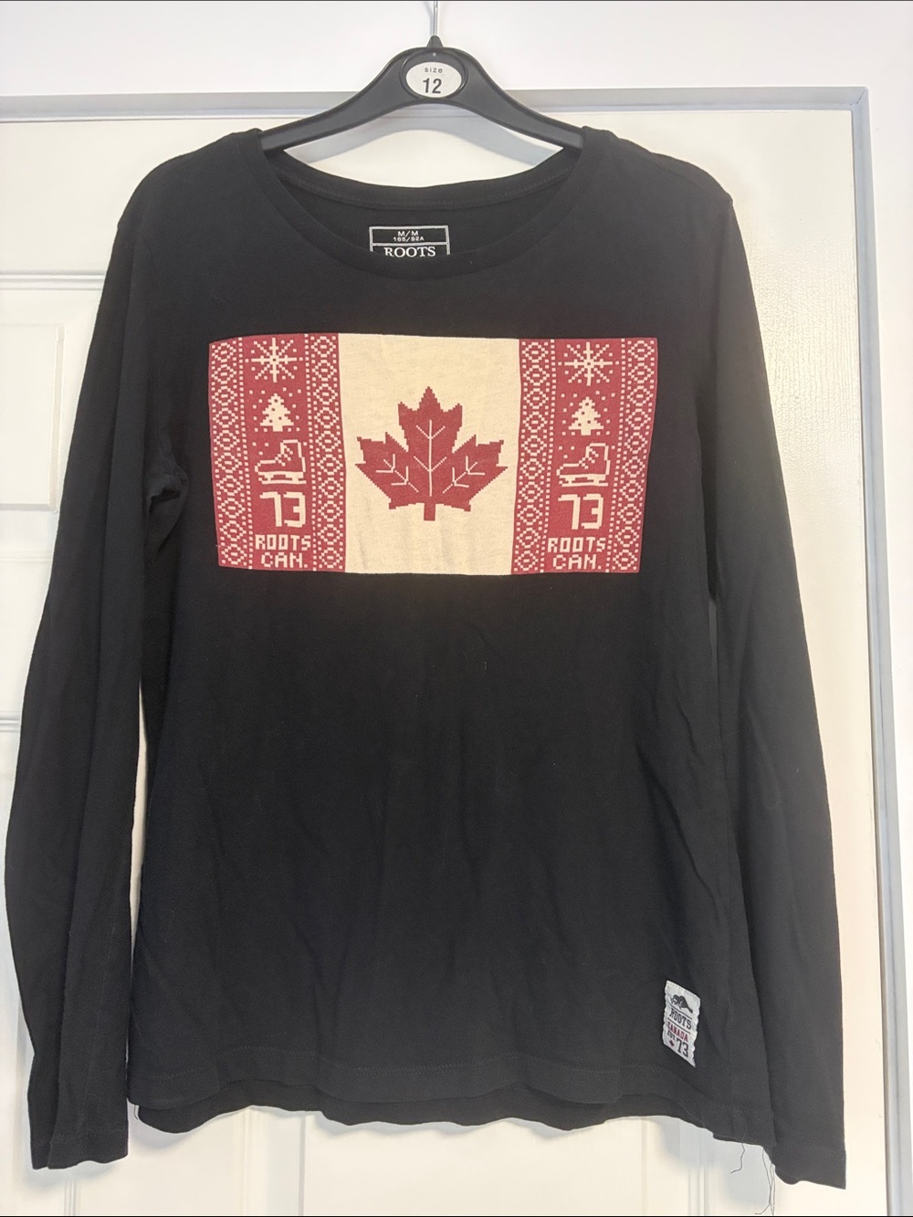 Roots Black Long-Sleeve Tee with Red and Cream Maple Leaf Graphic